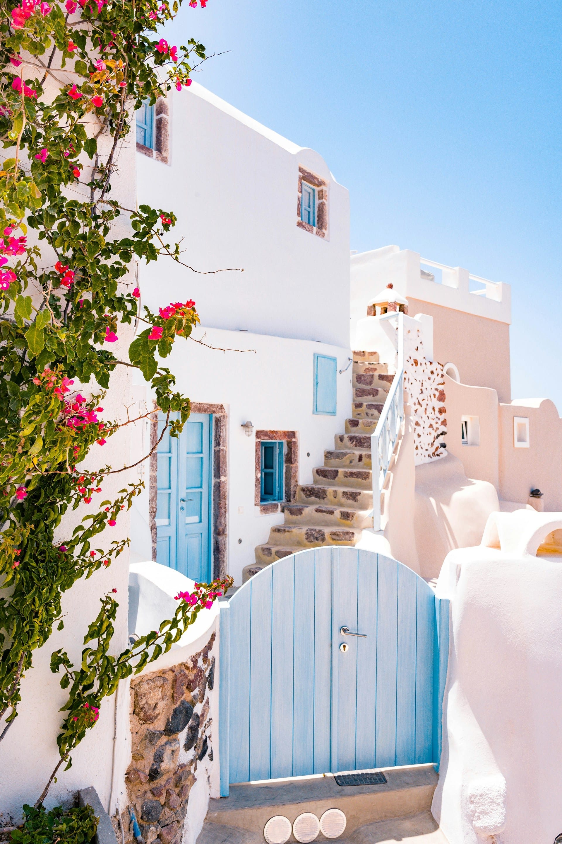 White outdoor staircase and bougainvillea